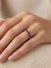 Red gold ring with blue sapphires