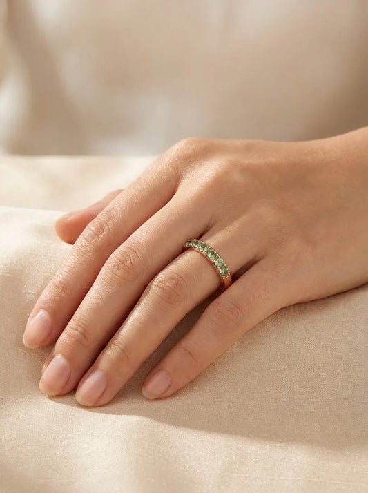 Red gold ring with green sapphires