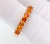 Red gold ring with orange sapphires