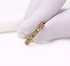 Red gold ring with green sapphires