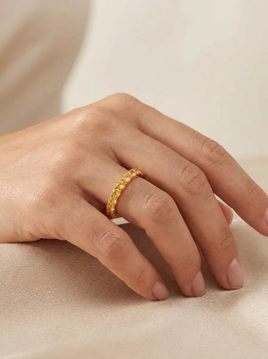 Red gold ring with yellow sapphires