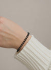 Gold black cord bracelet with 585 gold details