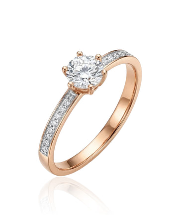 Rose gold ring with white central zircon and side holes