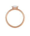 Rose gold ring with white central zircon and side holes