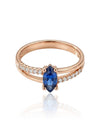 Red gold ring with blue zircon and side holes