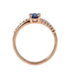 Red gold ring with blue zircon and side holes