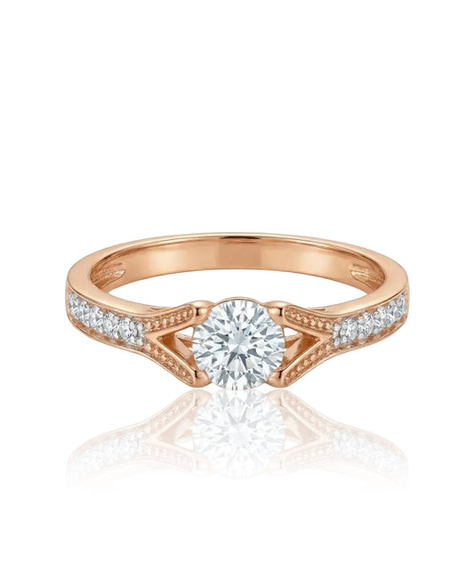 Red gold ring with white central zircon and side holes