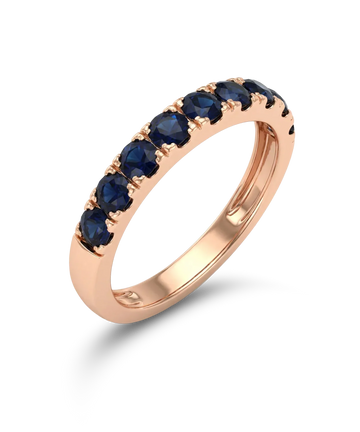 Red gold ring with blue sapphires